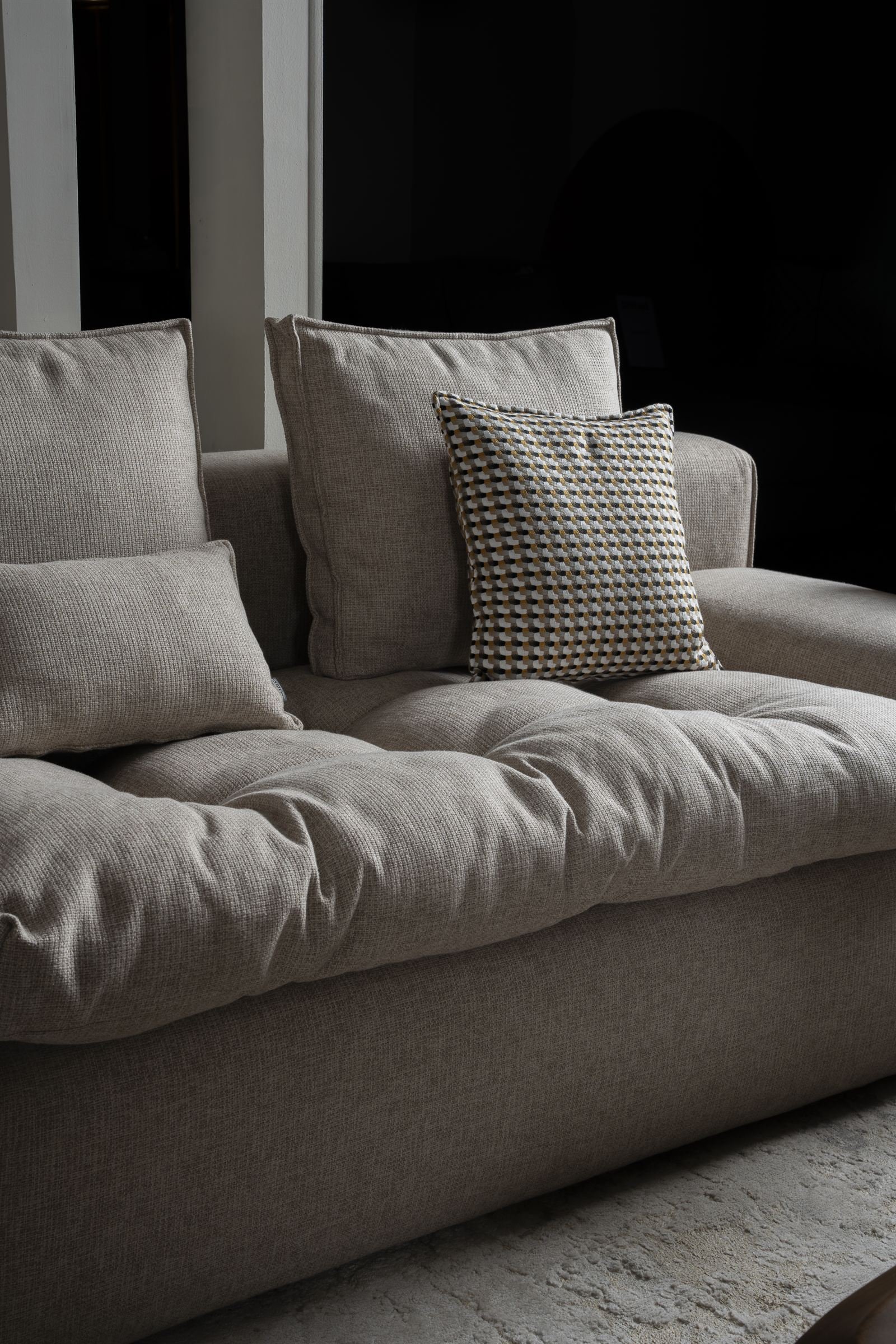 Cream sofa with cushions