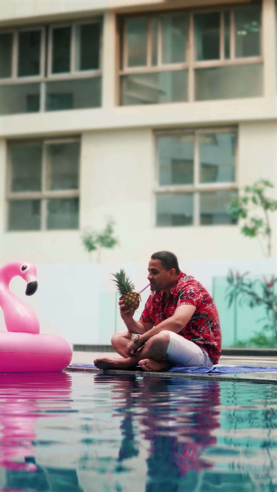 Morshedy Group — poolside with a pink flamingo float at ONE Kattameya