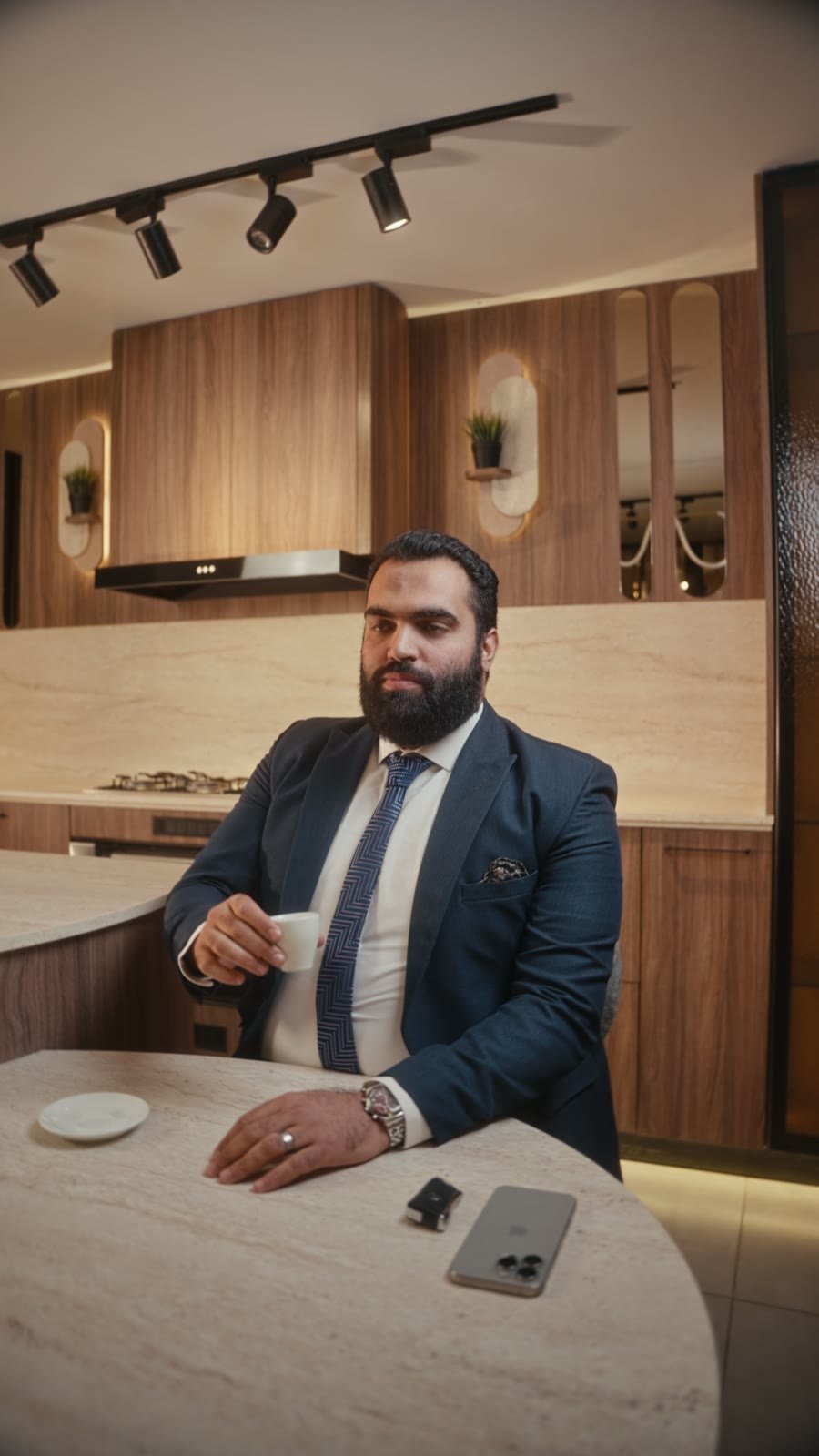 Mr. Home — coffee at a Signature Kitchen island in the showroom